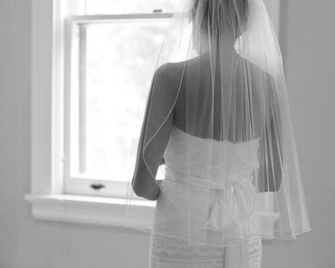 bride by window, from behind